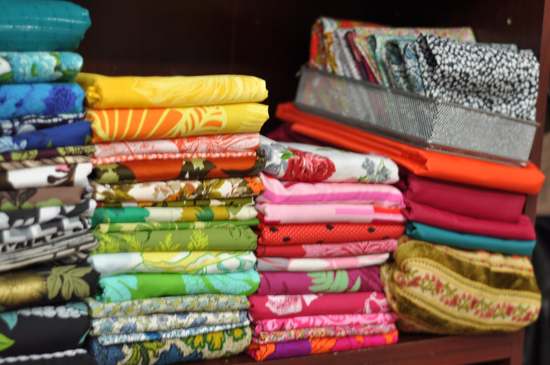 my stash of neatly folded fabrics